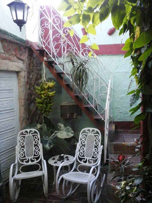 'Escaleras al piso superior' Casas particulares are an alternative to hotels in Cuba.